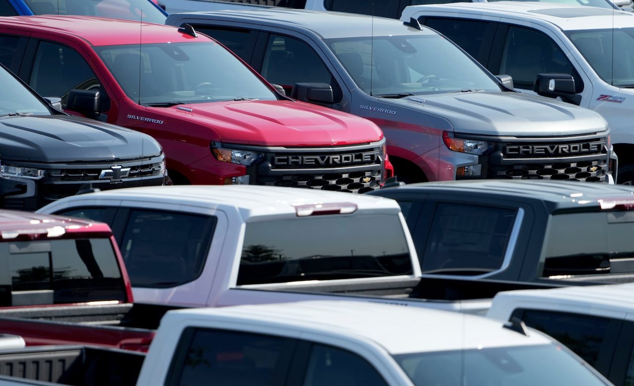 Multiple GM trucks of various colours.