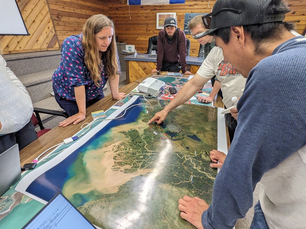 default-538 People standing around a map