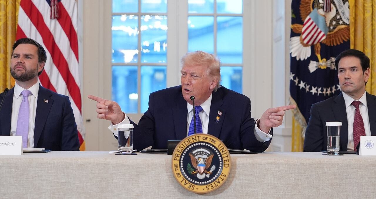 default-220 The President gestures with his fingers while talking into a microphone.