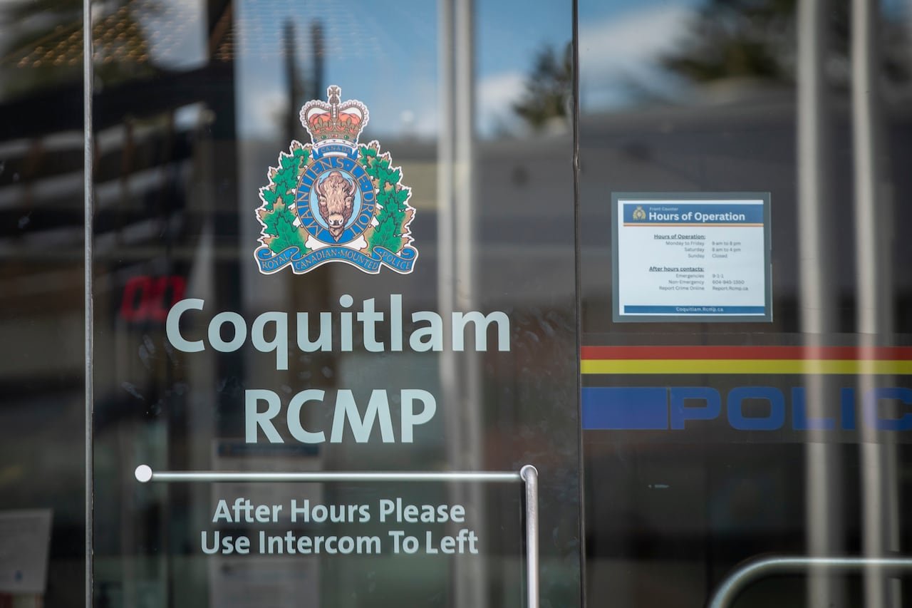 default-27 A sign outside a police detachment reads 'Coquitlam RCMP After Hours Please Use Intercom To Left.'