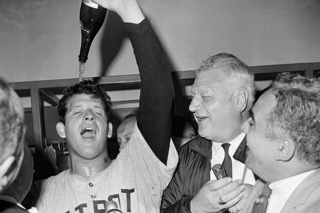 default-125 1968 celebratory moment as Detroit Tigers Pitcher Mickey Lolich pours champagne on himself after winning Game 7 of the World Series against the St. Louis Cardinals.